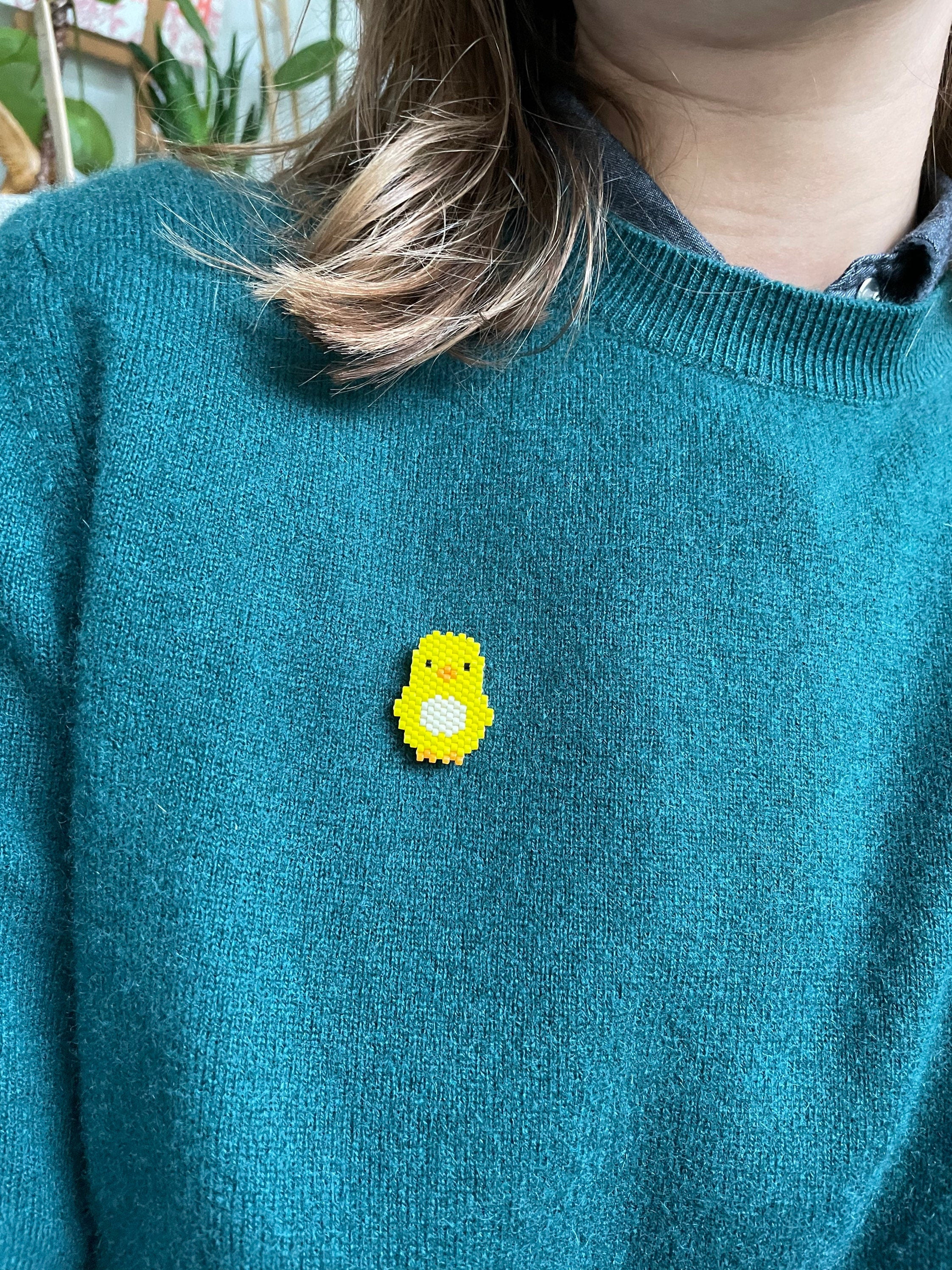 Broche Poussin